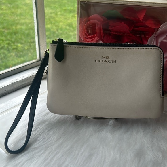 Coach Handbags - EUC,Coach two tone leather double zip wristlet wallet ivory and signature brown.